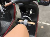 a scooter that is parked in a garage