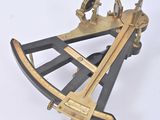 an old brass sexet on a white surface with a white background