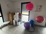 a room that has a bunch of balloons on the floor