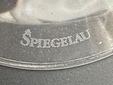 a close up of a silver plate with a picture on it