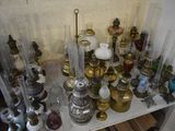 many different types of glass vases on a shelf