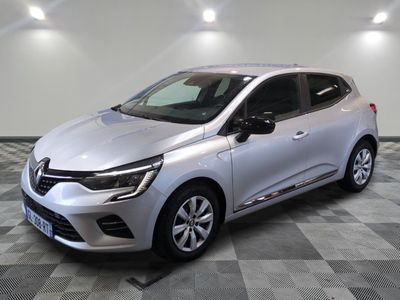 a silver car parked in a room with a checkered floor