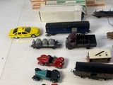 a lot of toy cars and trucks sitting on a table