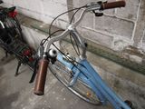 two bicycles parked next to each other in a garage