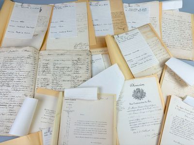 a pile of old papers that are on a table