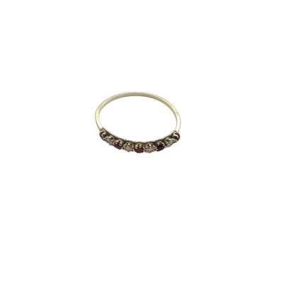 a close up of a silver ring on a white background