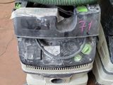 two vacuums sitting on top of each other on the floor