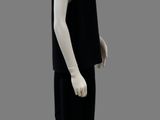 a mannequin wearing a black top and black pants