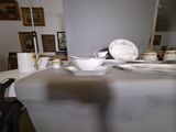 a table with a white table cloth and plates on it