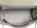 the inside of a white purse with a zipper on it