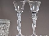 a lot of wine glasses that are stacked on top of each other