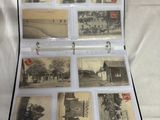 an open suitcase that has pictures of old buildings in it