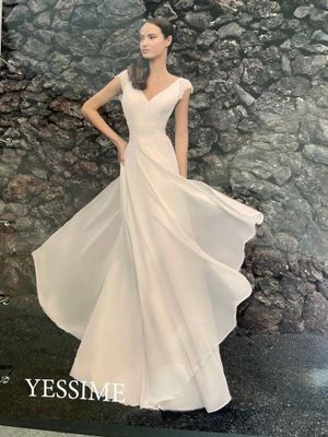 the cover of a magazine with a woman in a white dress