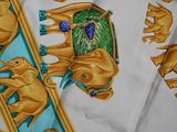 a close up of a scarf with elephants on it