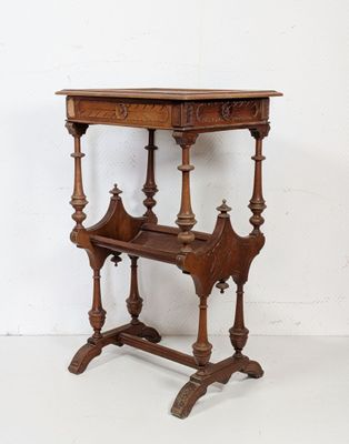 an old wooden table with a shelf on top of it