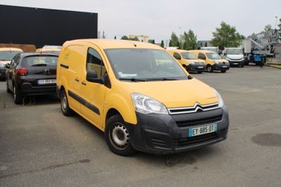 a yellow van that is parked in a parking lot