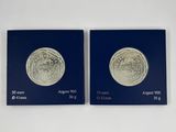 une paire de deux pièces d'argent posées l'une sur l'autre