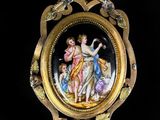 an image of a gold locke with a picture of a woman and two children