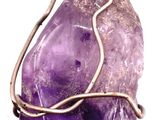 wire wrapped amethorate pendant with wire wrapped around it