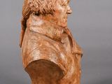 an image of a bust of a man with long hair