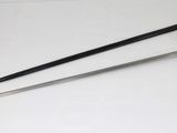 two swords sitting on a white table next to each other
