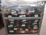 a cart full of bottles of wine sitting in a warehouse