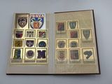 an open book with a picture of a bunch of badges on it
