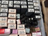 many boxes of makeup products on the shelf