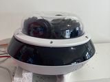 a black and white dome on top of a white table