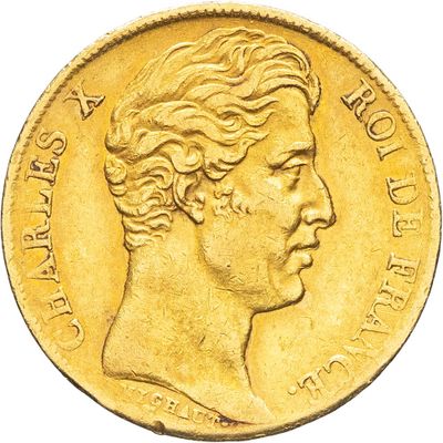 gros plan d'une pièce d'or portant un visage de femme