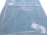a plastic sheet covering a mattress on a white surface