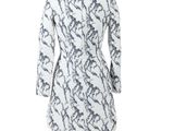 the back of a white dress with a black and white pattern
