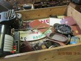 a wooden box filled with assorted items in a room