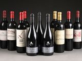 several bottles of wine are lined up in a row on a table
