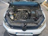 a car with its hood open and the engine in the trunk