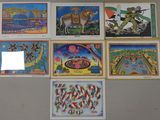 a lot of pictures on the wall of a room