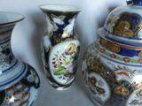 three vases sitting next to each other on a table