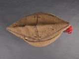 a brown hat with a red ribbon on it