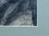 a drawing of a woman ' s face on a piece of paper