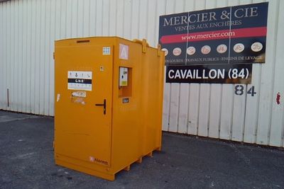 a yellow box that is sitting in front of a building