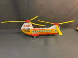 a toy helicopter that is sitting on a table