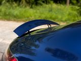 a close up of a car ' s tail light on the road