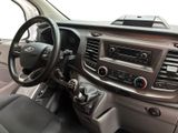 a dashboard of a car with a steering wheel and dashboard controls