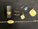 a lot of jewelry that is laying out on the table