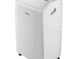 a white portable air conditioner sitting on top of a white table