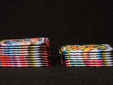a set of six folded napkins with colorful designs on them