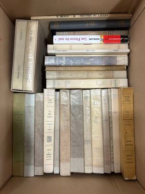 a lot of books in a box with a ruler