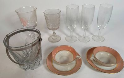 a lot of glassware sitting on a white table