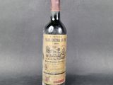 a close up of a bottle of wine on a table