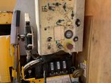 a machine that is sitting on top of a yellow table